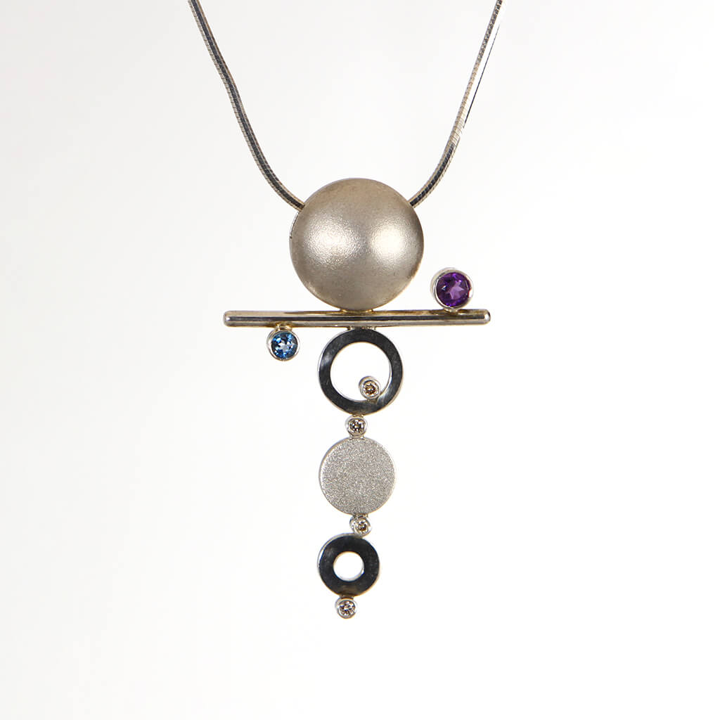 “Orbit” – SS pendant, satin finished, topaz, amethyst, diamond